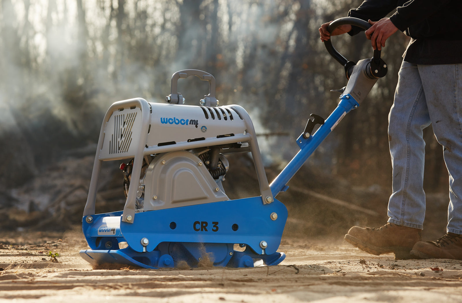 Gas-powered plate compactor ensuring proper compaction for long-lasting paver patio
