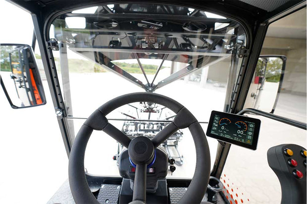 An orange and black S24 PaveJet paver laying machine - interior cabin